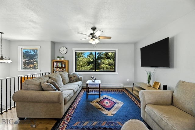 801 Iowa St, Belgrade, MT 59714 - living room featuring ceiling fan, wood finished floors, and a textured ceiling