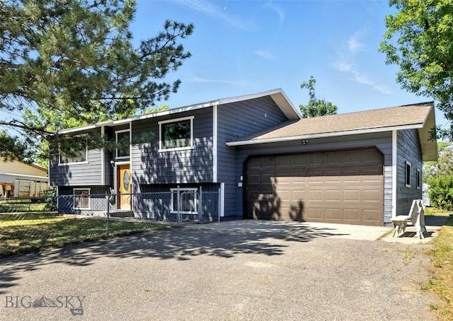 801 Iowa St, Belgrade, MT 59714 - view of front of property featuring asphalt driveway and a garage