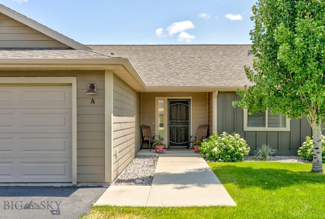 9848 Durston Rd Unit A, Bozeman, MT 59718 - entrance to property featuring board and batten siding, a shingled roof, an attached garage, and a yard