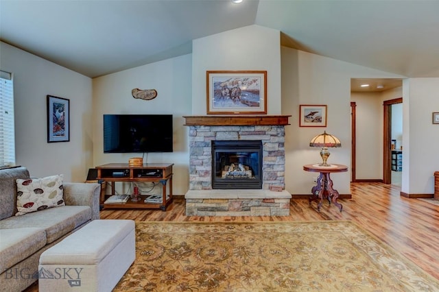 9848 Durston Rd Unit A, Bozeman, MT 59718 - living area with lofted ceiling, wood finished floors, a stone fireplace, and recessed lighting