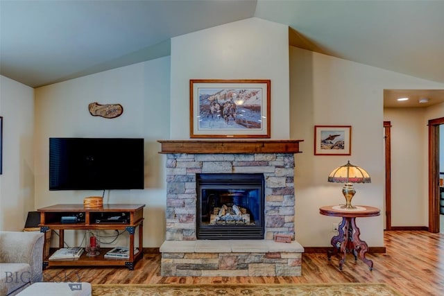 9848 Durston Rd Unit A, Bozeman, MT 59718 - living area with vaulted ceiling, wood finished floors, and a fireplace
