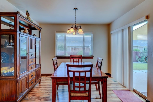 9848 Durston Rd Unit A, Bozeman, MT 59718 - dining room with light wood finished floors, a chandelier, and healthy amount of natural light