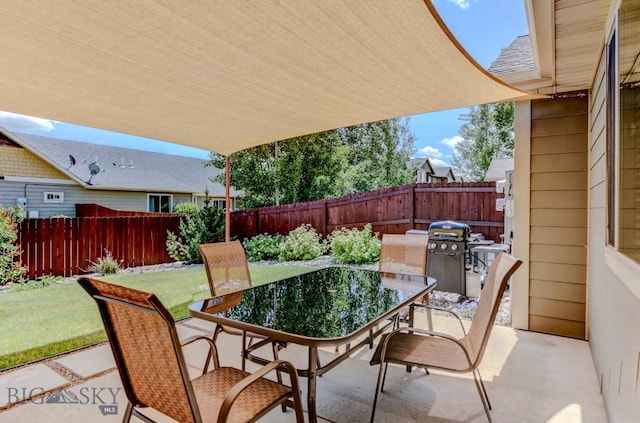 9848 Durston Rd Unit A, Bozeman, MT 59718 - fenced backyard featuring outdoor dining area, a patio, and grilling area