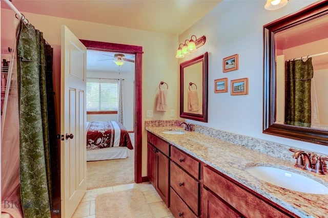 9848 Durston Rd Unit A, Bozeman, MT 59718 - full bath featuring double vanity, tile patterned floors, connected bathroom, and ceiling fan