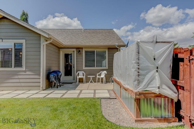9848 Durston Rd Unit A, Bozeman, MT 59718 - rear view of property featuring a patio area, roof with shingles, and a yard
