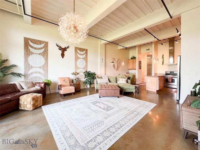 140 Village Crossing Way Unit 1J, Bozeman, MT 59715 - living area featuring finished concrete flooring, a chandelier, a wood ceiling with exposed beams, and a high ceiling