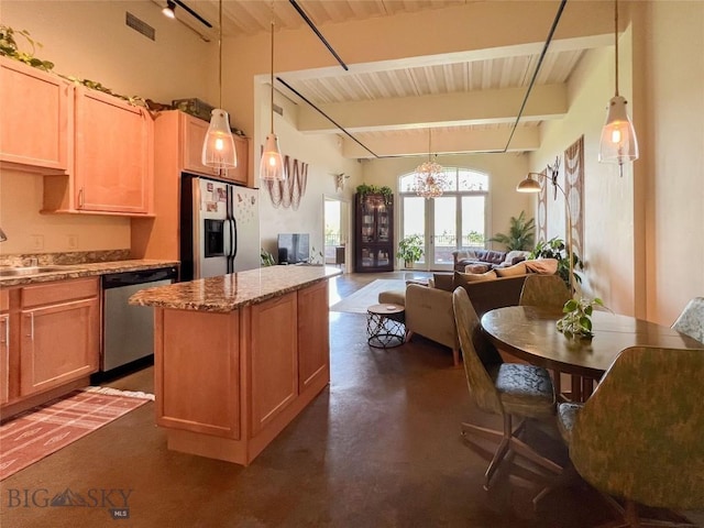 140 Village Crossing Way Unit 1J, Bozeman, MT 59715 - kitchen featuring appliances with stainless steel finishes, a chandelier, a center island, open floor plan, and wooden ceiling