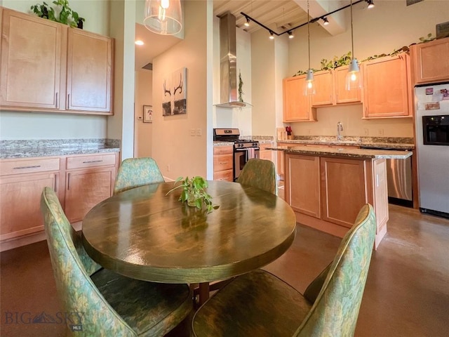 140 Village Crossing Way Unit 1J, Bozeman, MT 59715 - dining area with rail lighting and concrete flooring