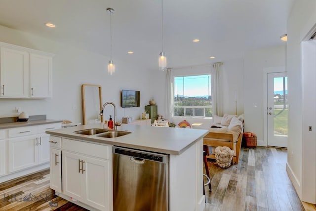 2002 Chipset St Unit A, Bozeman, MT 59718 - kitchen featuring stainless steel dishwasher, healthy amount of natural light, light wood-type flooring, light countertops, and recessed lighting