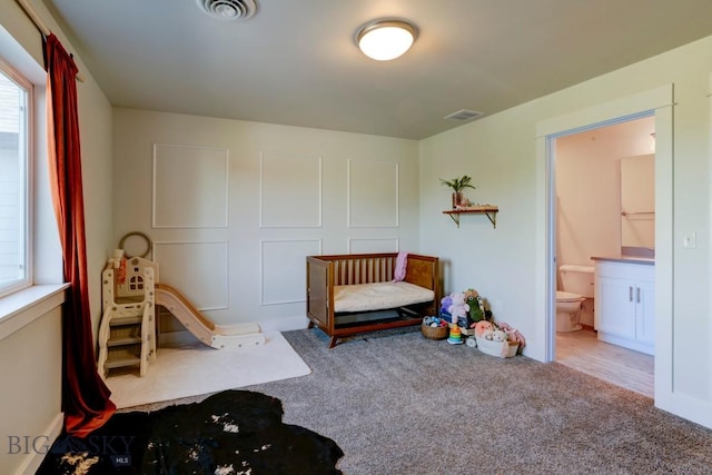 2002 Chipset St Unit A, Bozeman, MT 59718 - bedroom with carpet flooring, multiple windows, and connected bathroom