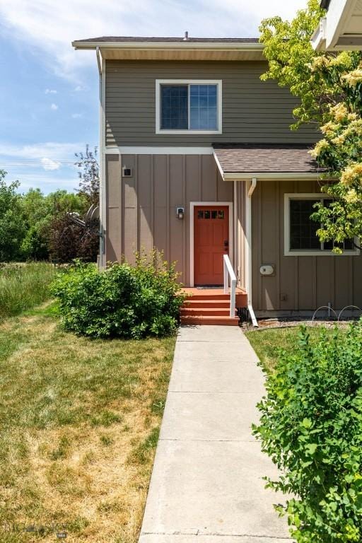 332 N Cottonwood Rd Unit F, Bozeman, MT 59718 - property entrance featuring board and batten siding and a yard