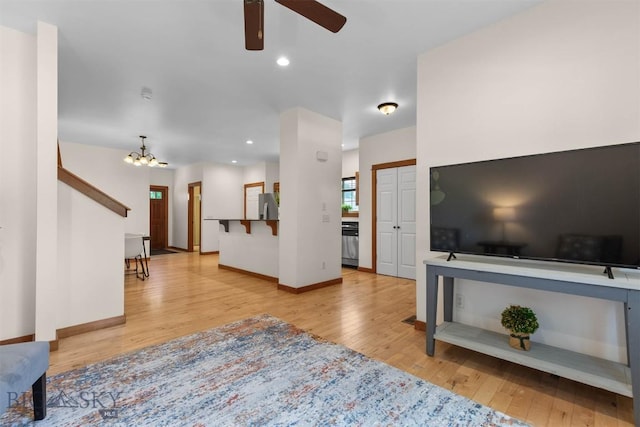 332 N Cottonwood Rd Unit F, Bozeman, MT 59718 - living area with wood finished floors, a ceiling fan, a chandelier, and recessed lighting