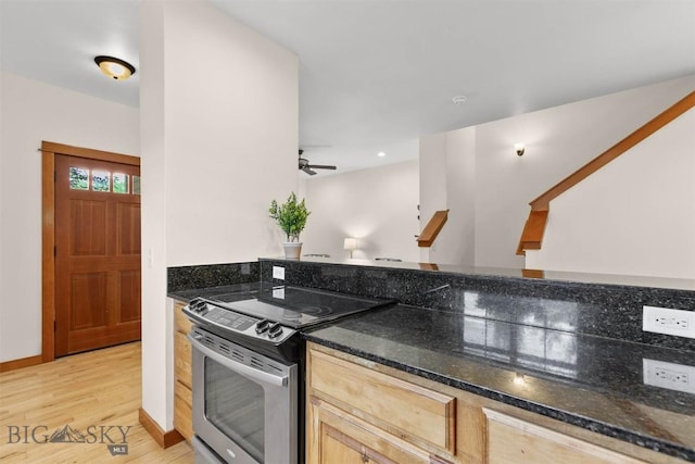 332 N Cottonwood Rd Unit F, Bozeman, MT 59718 - kitchen with stainless steel range with electric cooktop, light wood-style flooring, dark stone countertops, and a ceiling fan