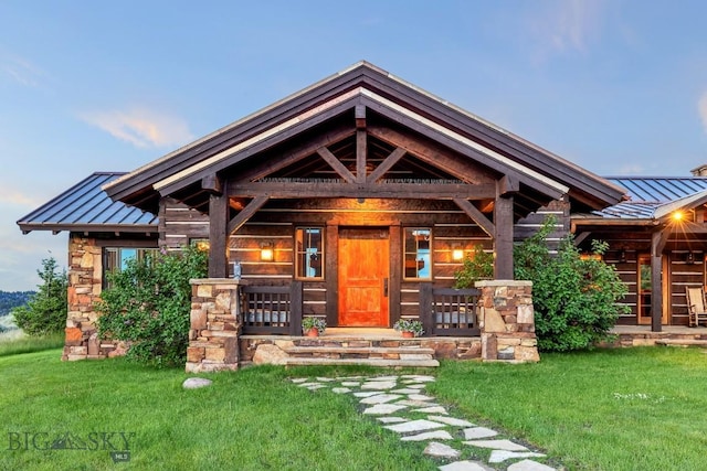 94 Sky Band Trl, Livingston, MT 59047 - view of front of home featuring a standing seam roof, a metal roof, a front lawn, and stone siding