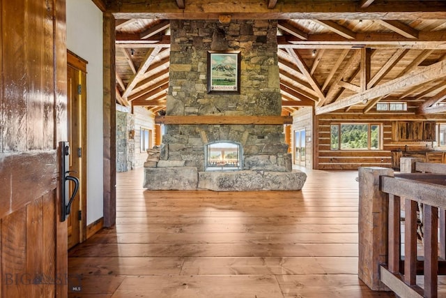 94 Sky Band Trl, Livingston, MT 59047 - unfurnished living room with a wooden ceiling with exposed beams, hardwood / wood-style floors, and high vaulted ceiling