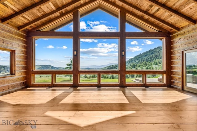 94 Sky Band Trl, Livingston, MT 59047 - unfurnished sunroom with wood ceiling, a deck with mountain view, hardwood / wood-style flooring, and wooden walls