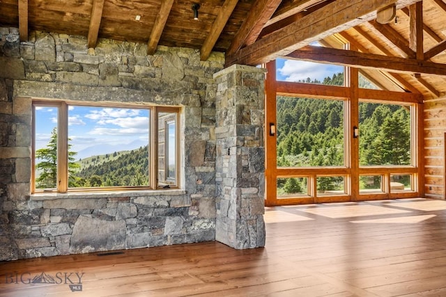 94 Sky Band Trl, Livingston, MT 59047 - unfurnished living room featuring wooden ceiling, wood-type flooring, and healthy amount of natural light