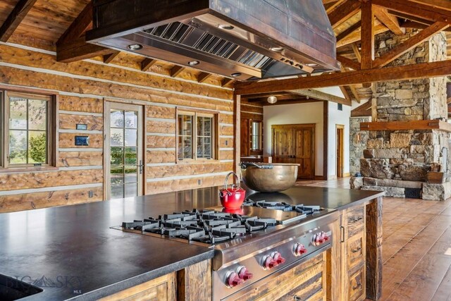 94 Sky Band Trl, Livingston, MT 59047 - kitchen featuring stainless steel gas cooktop, extractor fan, hardwood / wood-style floors, dark countertops, and wood ceiling