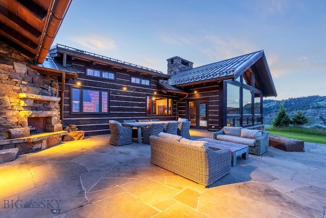 94 Sky Band Trl, Livingston, MT 59047 - view of patio featuring an outdoor living space with a fireplace