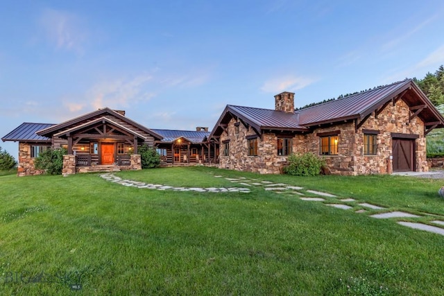 94 Sky Band Trl, Livingston, MT 59047 - rear view of property with a standing seam roof, a chimney, a metal roof, and stone siding