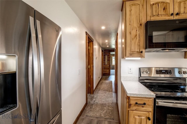 107 Antelope Meadows Rd, Ennis, MT 59729 - kitchen with appliances with stainless steel finishes, dark wood-style floors, light stone countertops, and recessed lighting