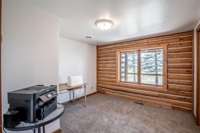 107 Antelope Meadows Rd, Ennis, MT 59729 - miscellaneous room with log walls and carpet flooring