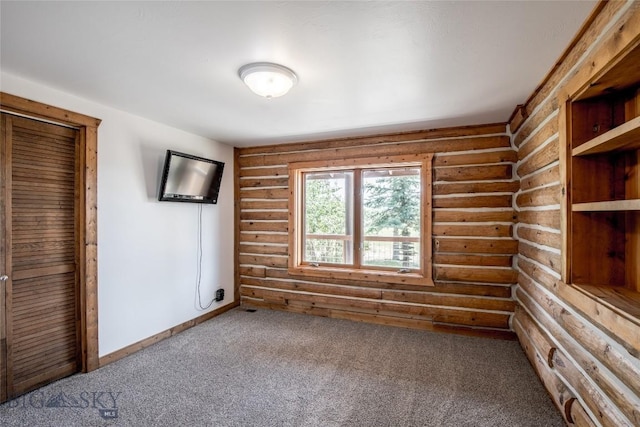 107 Antelope Meadows Rd, Ennis, MT 59729 - unfurnished bedroom featuring log walls and carpet floors