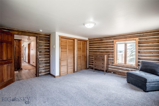 107 Antelope Meadows Rd, Ennis, MT 59729 - unfurnished room with log walls and carpet
