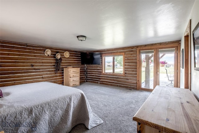 107 Antelope Meadows Rd, Ennis, MT 59729 - bedroom featuring rustic walls, access to exterior, and carpet flooring