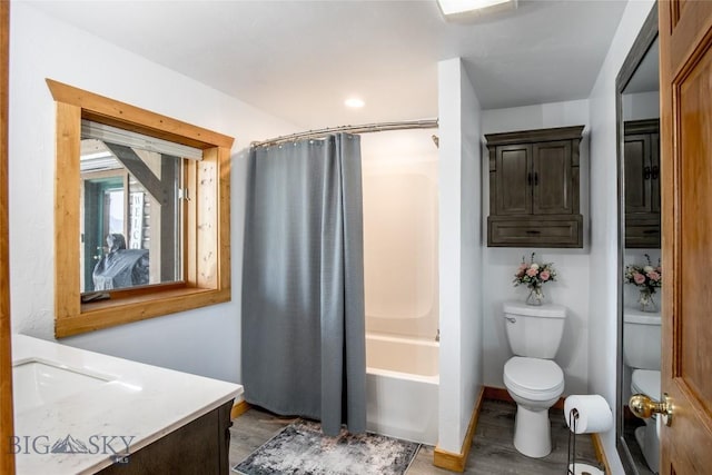 107 Antelope Meadows Rd, Ennis, MT 59729 - full bathroom with wood finished floors, vanity, and shower / bath combo with shower curtain
