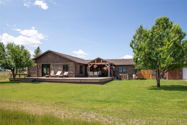 107 Antelope Meadows Rd, Ennis, MT 59729 - rear view of property with log exterior, a wooden deck, and a yard