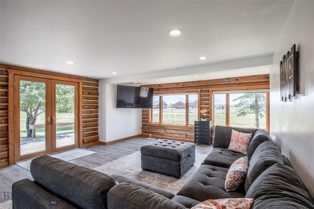 107 Antelope Meadows Rd, Ennis, MT 59729 - living area featuring french doors, wood finished floors, log walls, and recessed lighting