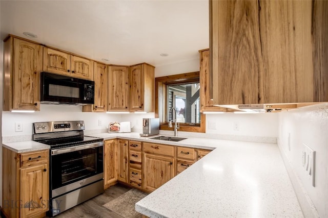 107 Antelope Meadows Rd, Ennis, MT 59729 - kitchen featuring black microwave, stainless steel range with electric cooktop, light countertops, and dark wood-style flooring