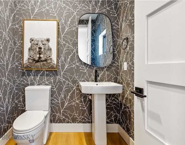 1492 Windrow Dr, Bozeman, MT 59718 - bathroom featuring wallpapered walls and wood finished floors