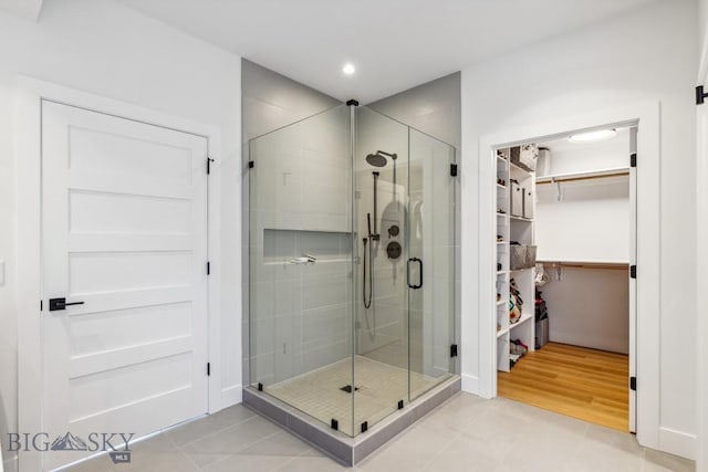1492 Windrow Dr, Bozeman, MT 59718 - full bathroom with a walk in closet, a shower stall, tile patterned floors, and recessed lighting