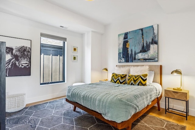 1492 Windrow Dr, Bozeman, MT 59718 - bedroom featuring baseboards and wood finished floors