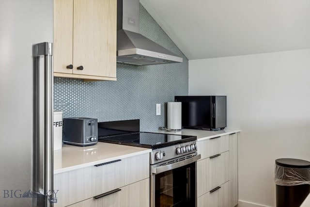 1492 Windrow Dr, Bozeman, MT 59718 - kitchen featuring wall chimney exhaust hood, stainless steel electric range, light countertops, vaulted ceiling, and tasteful backsplash