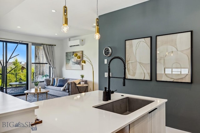 1492 Windrow Dr, Bozeman, MT 59718 - kitchen with a wall mounted air conditioner, light countertops, hanging light fixtures, open floor plan, and recessed lighting