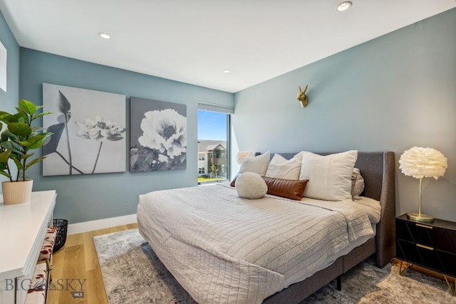 1492 Windrow Dr, Bozeman, MT 59718 - bedroom featuring wood finished floors and recessed lighting