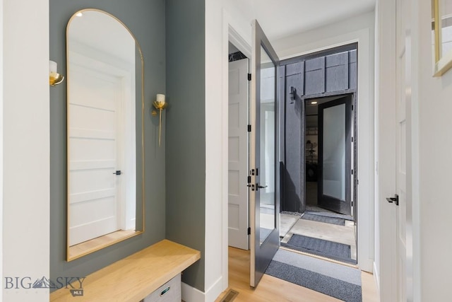 1492 Windrow Dr, Bozeman, MT 59718 - mudroom with light wood-style flooring and arched walkways