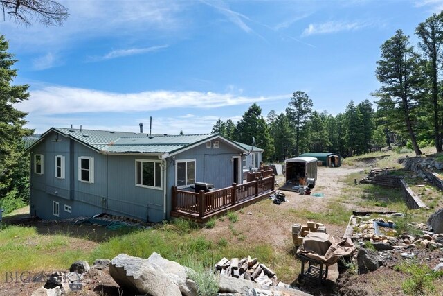 16 Friendspring Mt, Whitehall, MT 59759 - back of house with a deck and a metal roof