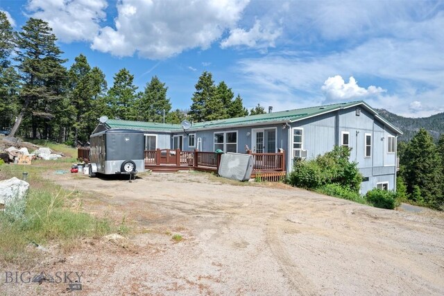 16 Friendspring Mt, Whitehall, MT 59759 - manufactured / mobile home featuring a deck, a metal roof, and cooling unit