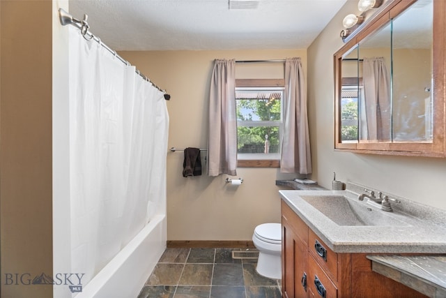 120 N Pine Butte, Bozeman, MT 59718 - bathroom featuring vanity, stone finish floors, and shower / bath combo with shower curtain