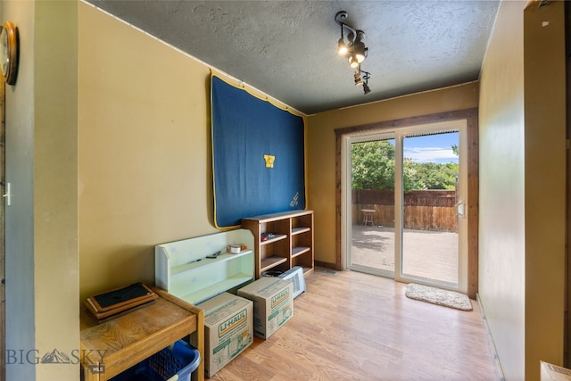 120 N Pine Butte, Bozeman, MT 59718 - living area featuring a textured ceiling and light wood-style floors