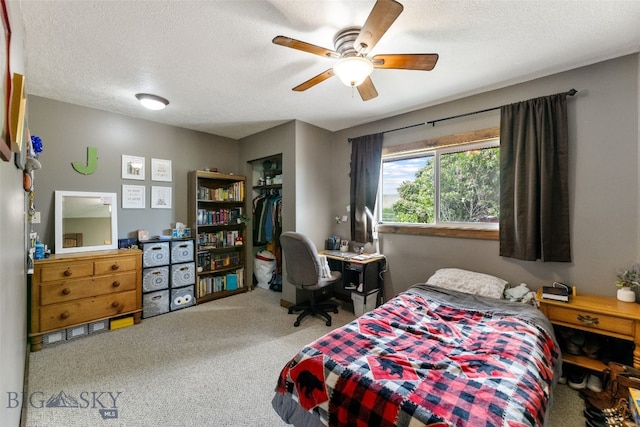 120 N Pine Butte, Bozeman, MT 59718 - carpeted bedroom with a textured ceiling, a closet, and ceiling fan