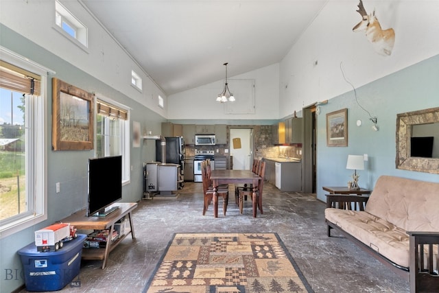 120 N Pine Butte, Bozeman, MT 59718 - living area featuring plenty of natural light, high vaulted ceiling, and a chandelier