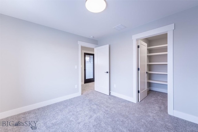 740 Rogers Way Unit A, Bozeman, MT 59718 - unfurnished bedroom with carpet floors and a spacious closet