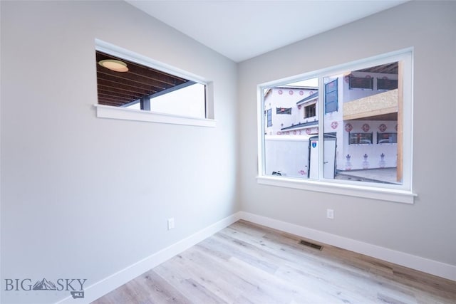 740 Rogers Way Unit A, Bozeman, MT 59718 - spare room with wood finished floors and plenty of natural light