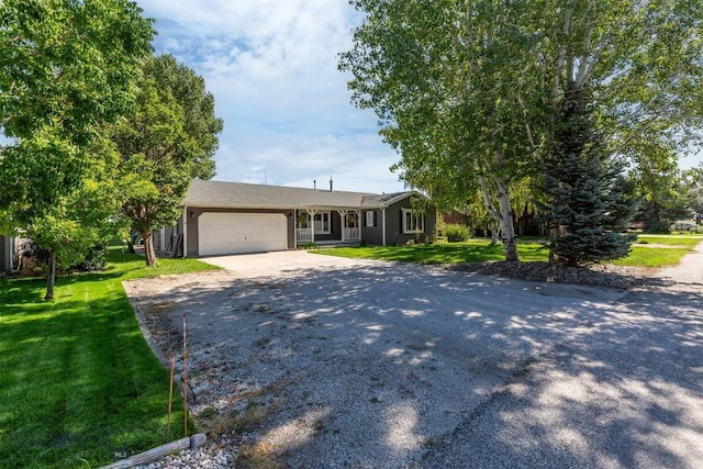 109 Cottonwood St, Manhattan, MT 59741 - single story home featuring driveway, an attached garage, and a front yard