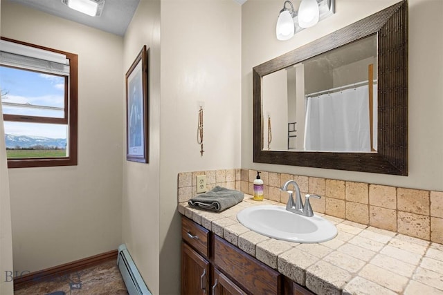 109 Cottonwood St, Manhattan, MT 59741 - full bathroom featuring vanity, tasteful backsplash, and a baseboard radiator